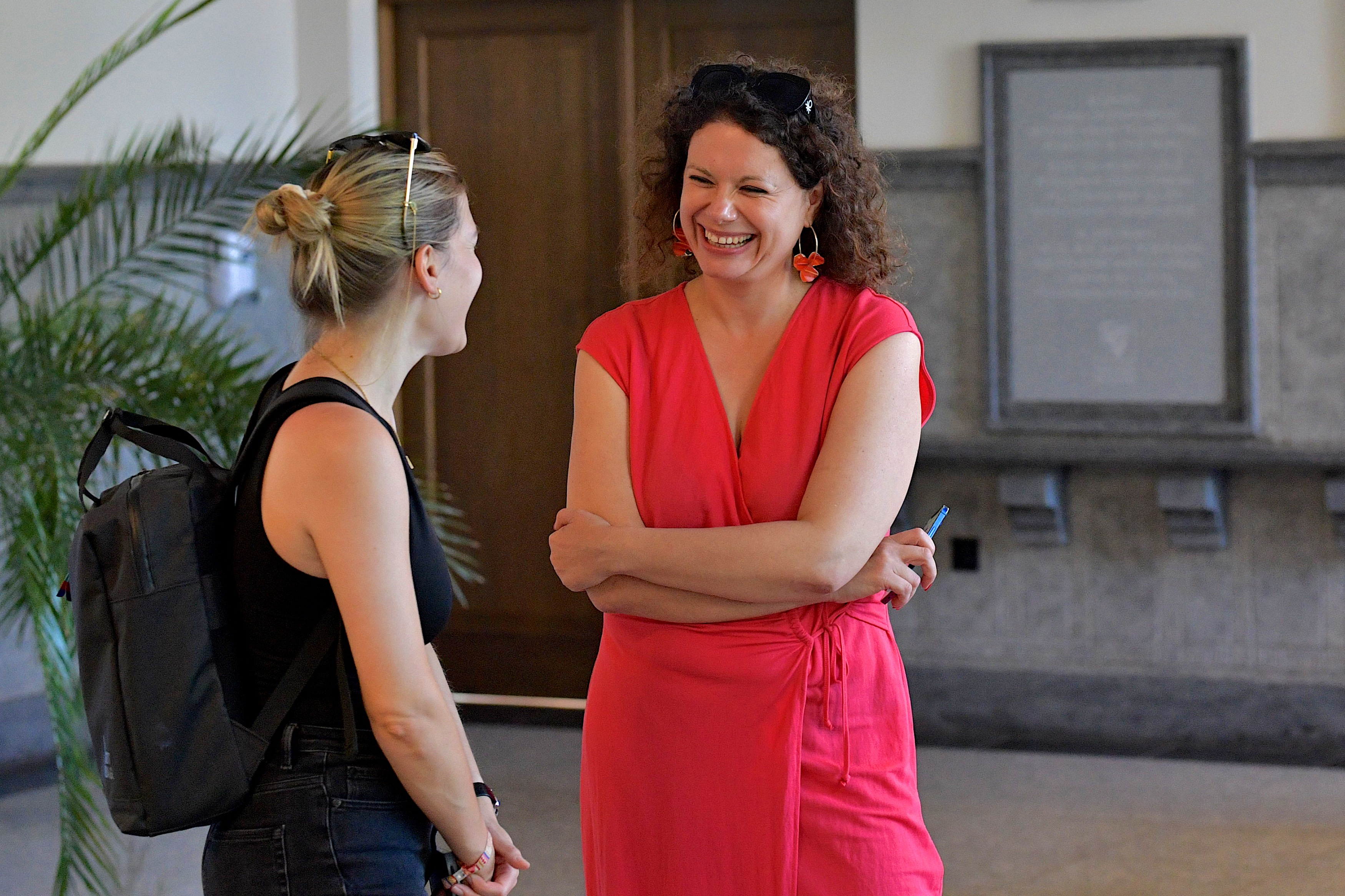 Image of two members of the Unite! community talking to each other