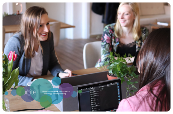 See larger image Three women discussing in a work environment